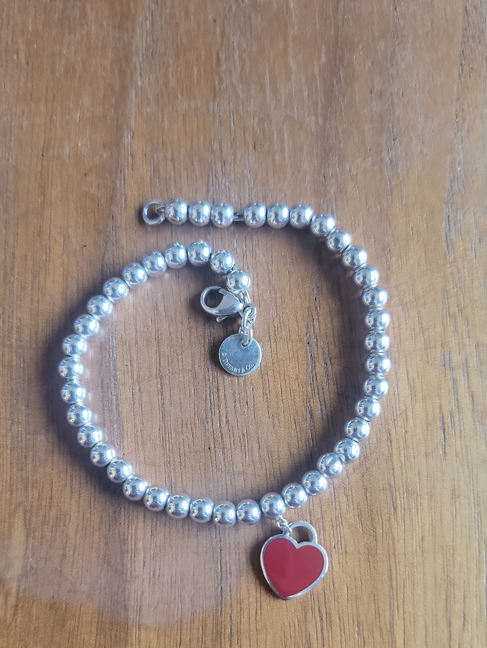 Tiffany & Co. Silver Bracelet with Red Heart Charm